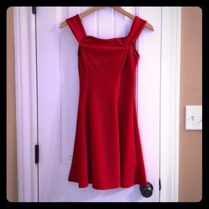 Knee-length red sleeveless dress
